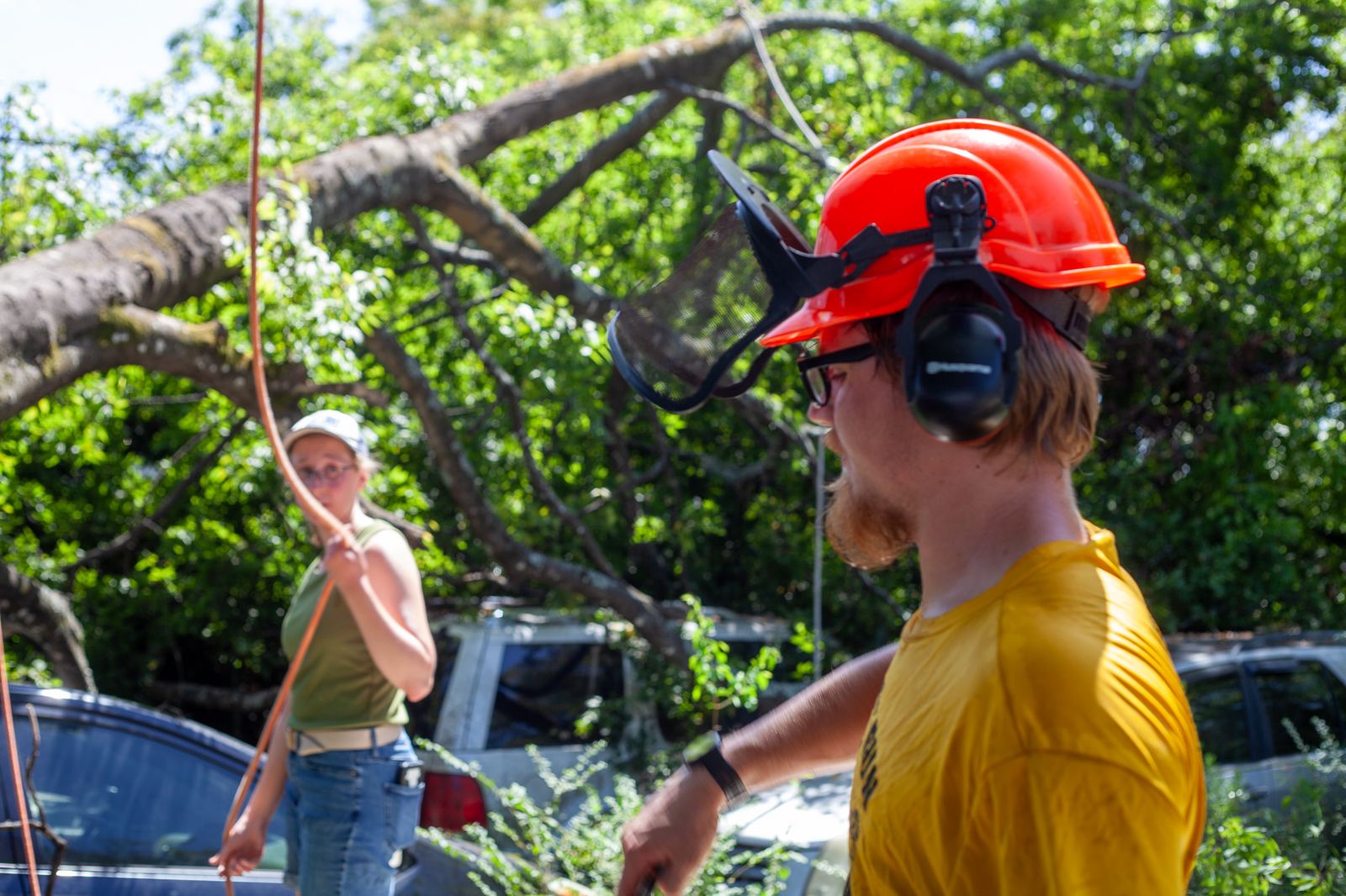 Two of the crew working a rigging line together